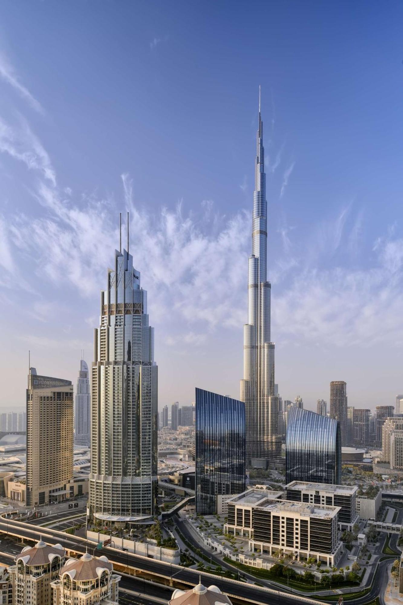 Kempinski The Boulevard Ντουμπάι Εξωτερικό φωτογραφία The tower (right) with the Burj Khalifa (left)